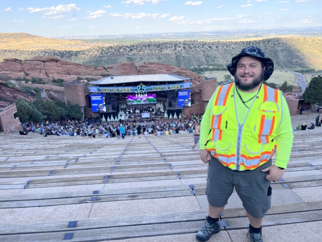 man wearing high-vis vest at south park 25th anniversary stag