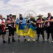 photo of WSM athletes with flags draped on them
