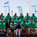 team photo of athletes wearing WSM green shirts