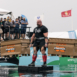 strong looking man lifting two knaack crates