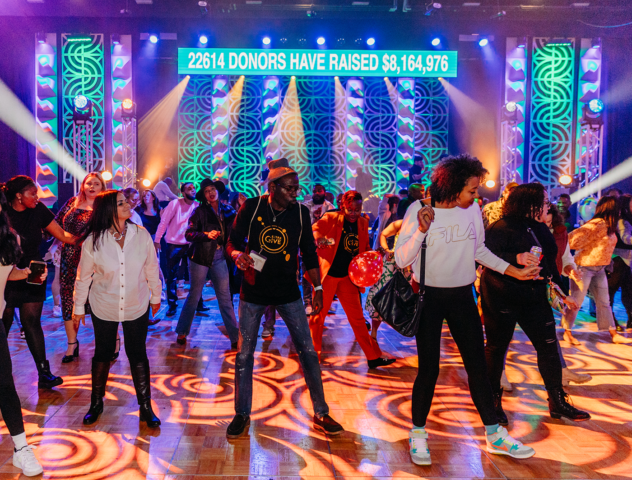 people on dance floor in front of stage
