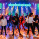 people on dance floor in front of stage