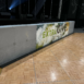 ATOMIC SuperLever panels make a short SuperWall with cusotm signage that reads "Extra Give"