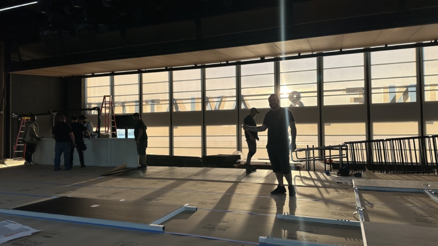 workers building a new custom stage