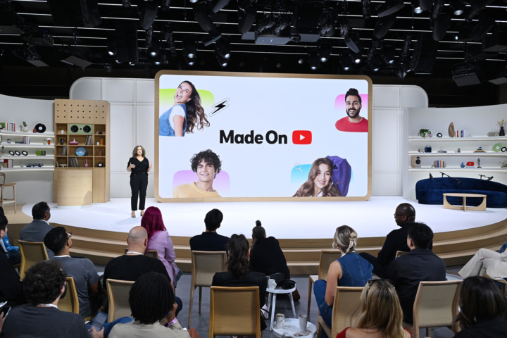 woman giving presentation in front of huge interactive screen