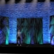 Rendering of Large-scale Shell modular scenic wall installed on stage under blue lighting.