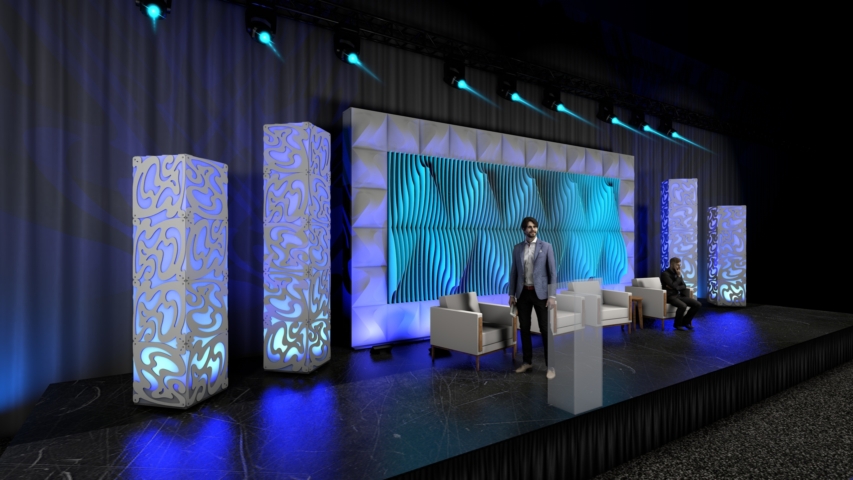 Rendering of a Shell modular scenic wall installed on a live event stage with presenters and scenic elements in front.