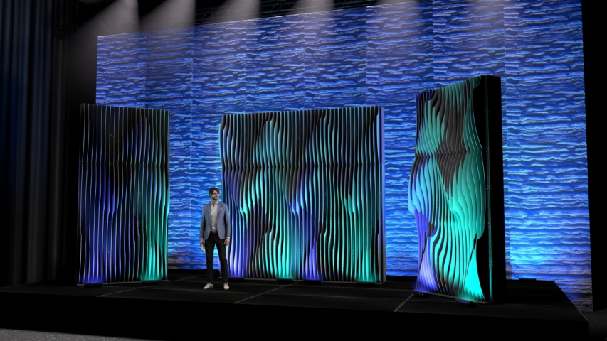 Rendering of a Shell modular scenic wall installed on stage with performers in front under blue and green lighting.