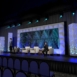 Rendering of a Wide audience-facing view of Shell modular scenic wall installed across a large stage environment.