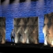 Rendering of a Shell modular scenic wall installed on a wide stage under warm lighting.