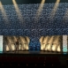 Rendering of a Full-width Shell modular scenic wall spanning a large stage environment.