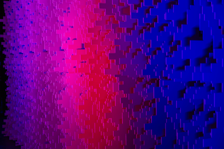 Close-up detail of Pixel modular scenic panel texture under pink and blue lighting.