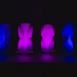 Shell modular scenic panels arranged in separated vertical configurations under purple lighting.