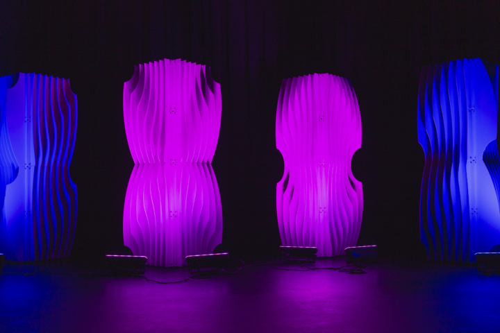 Single Shell modular scenic panel illuminated with purple lighting.