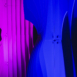 Close-up of Shell modular scenic panel surface under purple lighting.