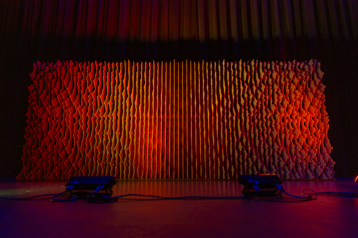 Pixel modular scenic wall on stage under low ambient lighting.