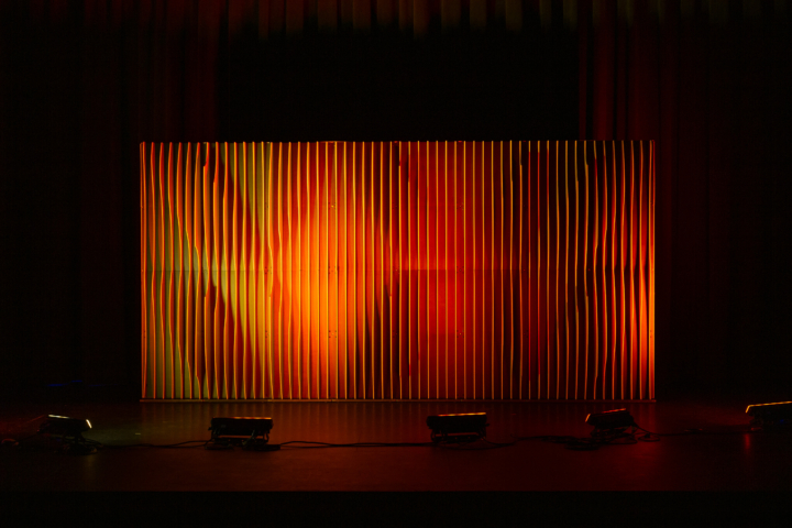 Shell modular scenic wall installed on stage under warm lighting conditions.