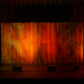 Shell modular scenic wall installed on stage under warm lighting conditions.