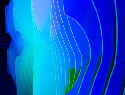 Close-up of Shell modular scenic panel showing curved surface geometry under blue and green lighting.