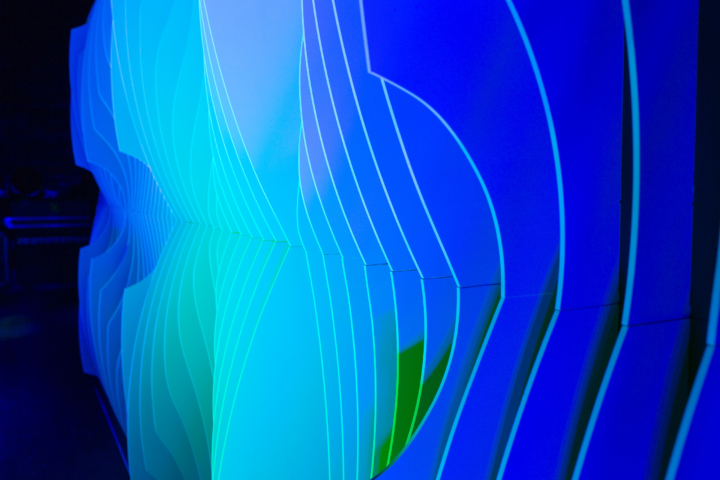 Close-up of Shell modular scenic panel showing curved surface geometry under blue and green lighting.