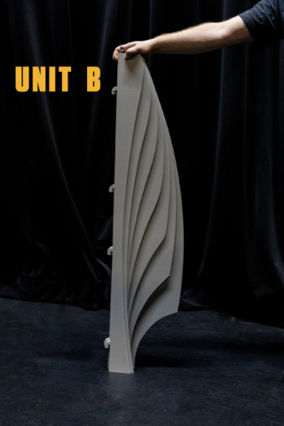 Side profile of a Shell Unit B modular scenic panel in studio with a hand visible for scale reference.